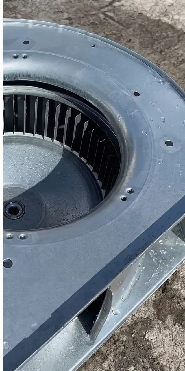 The same blower wheel and housing clean and bright after professional cleaning