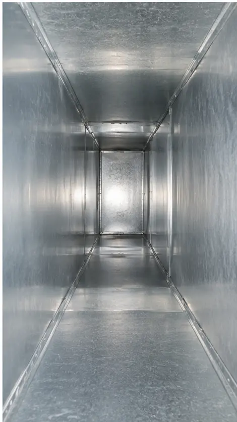 The same air duct after professional cleaning, bare metal with the dust removed